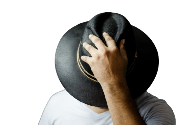 Man covering his face while holding a black wide-brim hat
